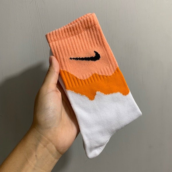 Producto - Media caña Nike combinada naranja