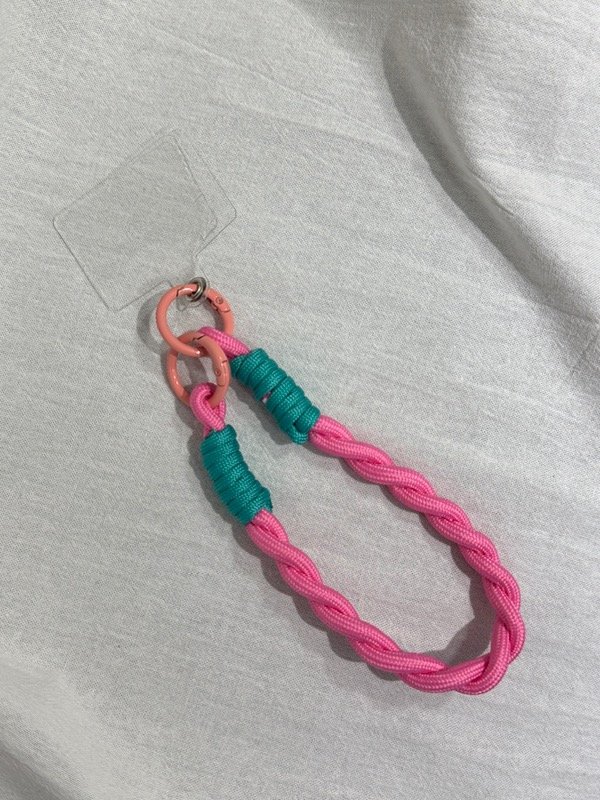 Producto - Handstrap fucsia con turquesa