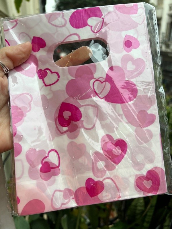 Producto - 100 bolsas 15x20 corazones fuccia