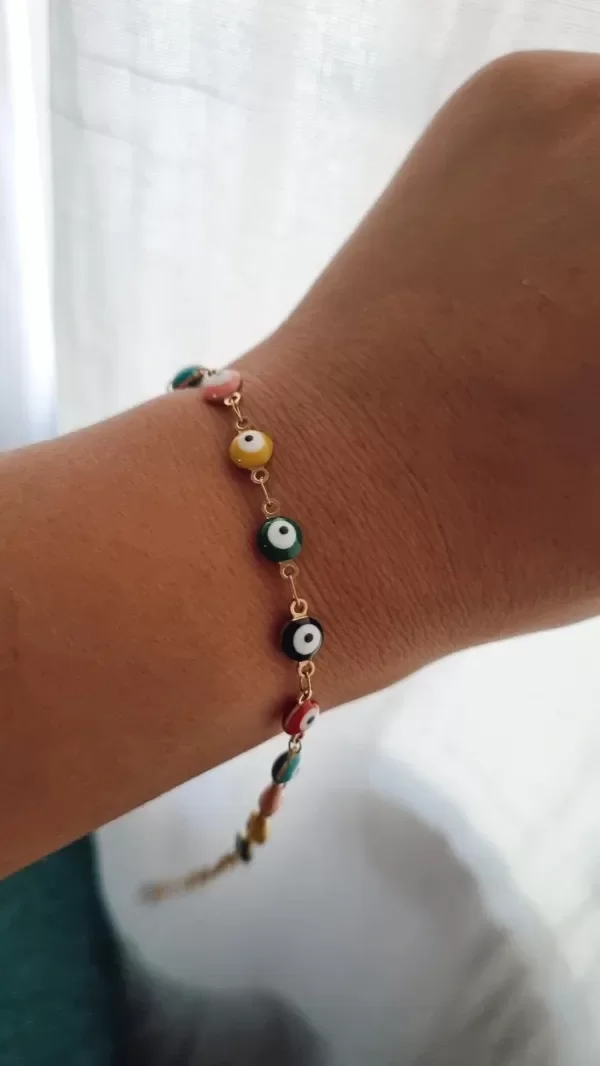 Producto - Pulsera ojitos de colores protectora acero dorado
