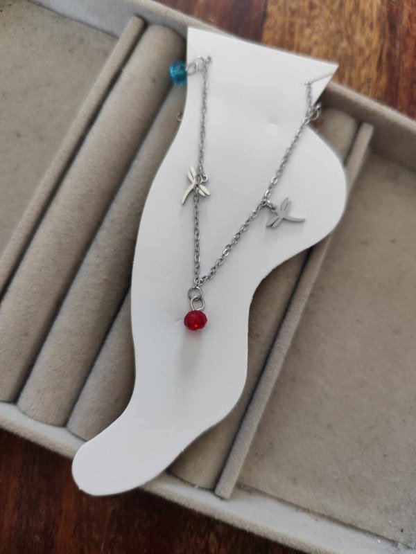 Producto - Tobillera libélula y piedras . Acero quirúrgico.