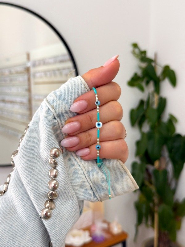 Producto - Pulsera celeste tres ojitos