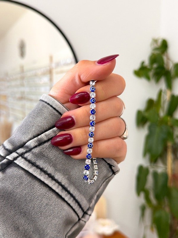 Producto - Pulsera acero quirúrgico ojitos azules y cúbics