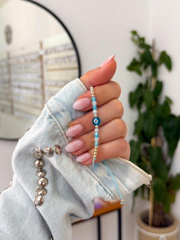 Producto - Pulsera mostacillas celestes grandes ojito