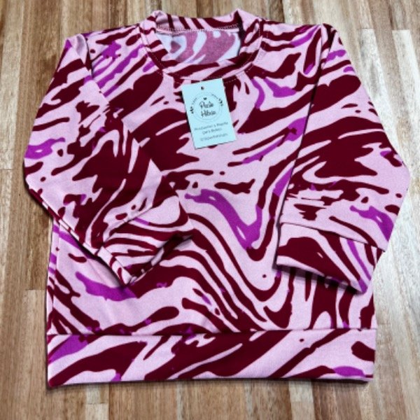 Producto - Buzo cebra rosa