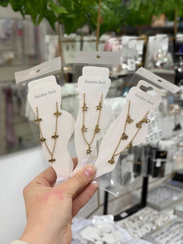 Producto - Tobillera acero dorado con dijes