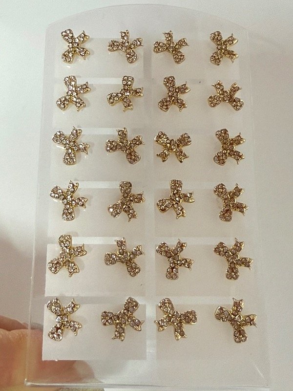 Producto - AD490 Blíster x 12  Aros moño con strass acero dorado