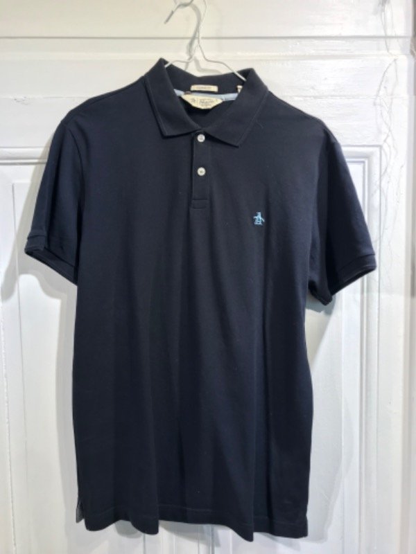 Producto - Chomba PENGUIN azul oscuro - Talle S- PRECIO: 50x