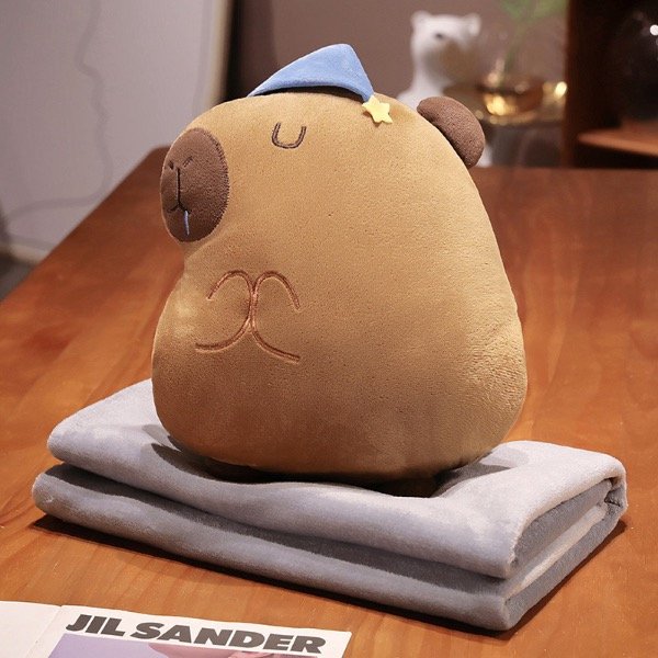 Producto - Peluche/almohada capybara con manta
