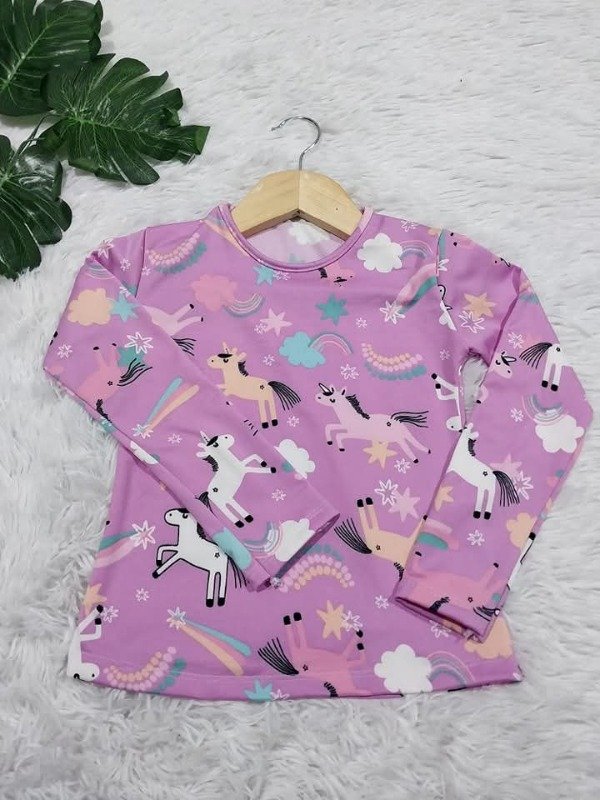 Producto - CAMISETA TERMICA" UNICORNIOS"
