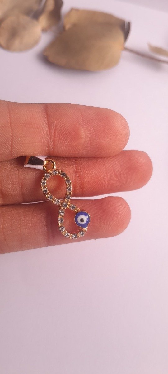 Producto - Dije acero dorado infinito ojo strass