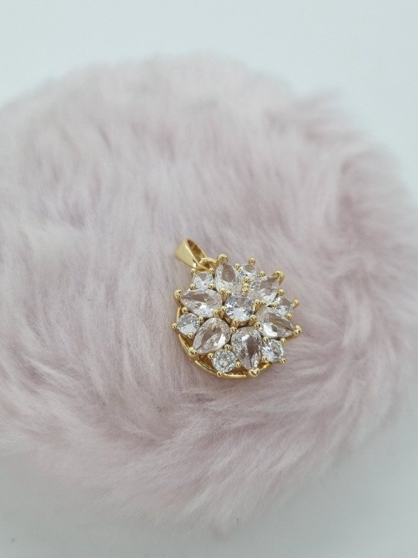 Producto - Dije acero dorado flor puntas gema swarovski giratorio