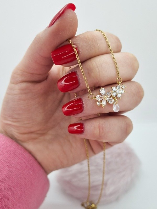 Producto - Cadena acero dorado dije doble flor y gota swarovski