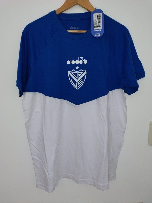 Producto - REMERA SALIDA DIADORA BLANCA Y AZUL