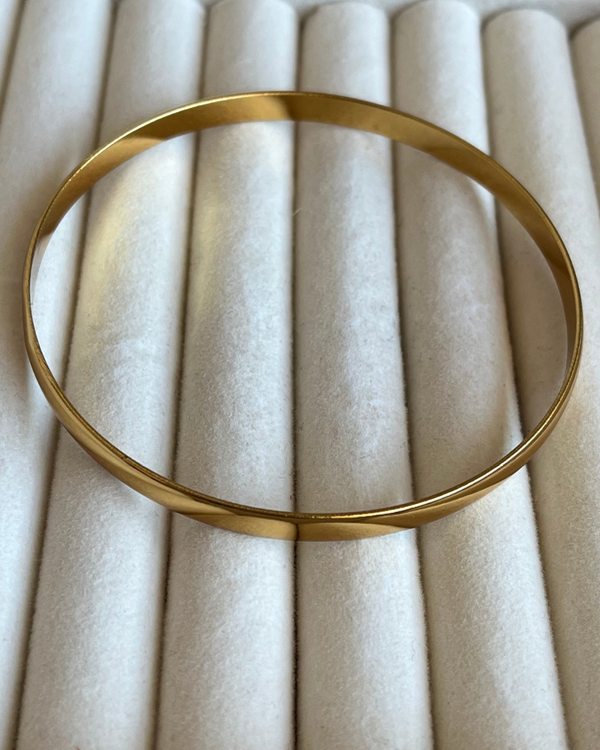 Producto - Pulsera esclava lisa de acero dorado 7cmd 6mm