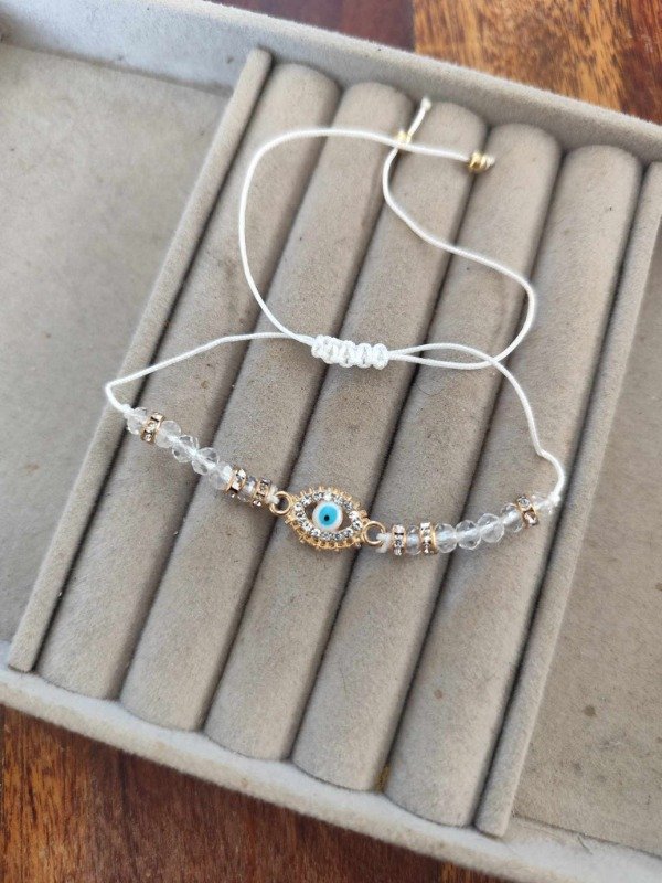 Producto - Pulsera hilo ojito blanca.