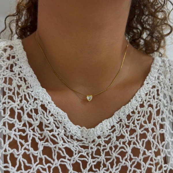 Producto - CONJUNTO DORADO CLAPTON CON CORAZON CUBIC PASANTE