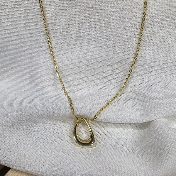 Producto - Conjunto Ac. Dorado con dije oval liso