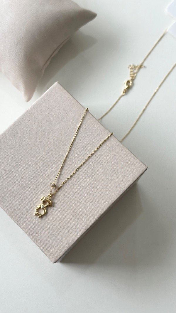 Producto - Conjunto dona una hija 45cm + 5 cm laminado en oro 18k