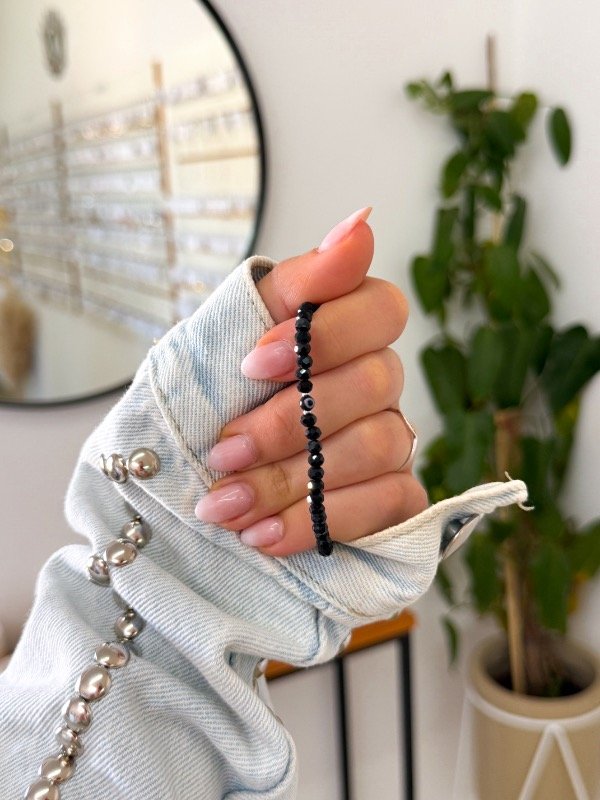 Producto - Pulsera acero quirúrgico mostacillas negras ojito