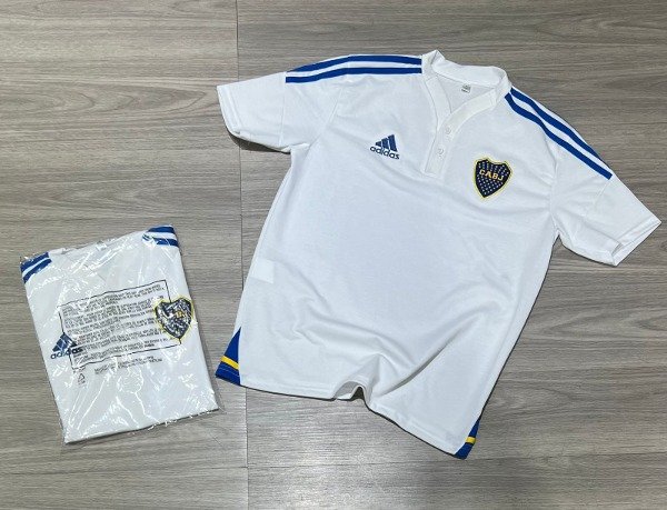 Producto - CHOMBA BOCA JRS BLANCA