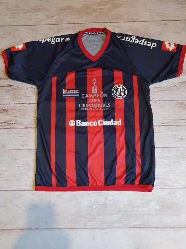 Producto - CAMISETA LOTTO 2014 CAMPEON LIBERTADORES