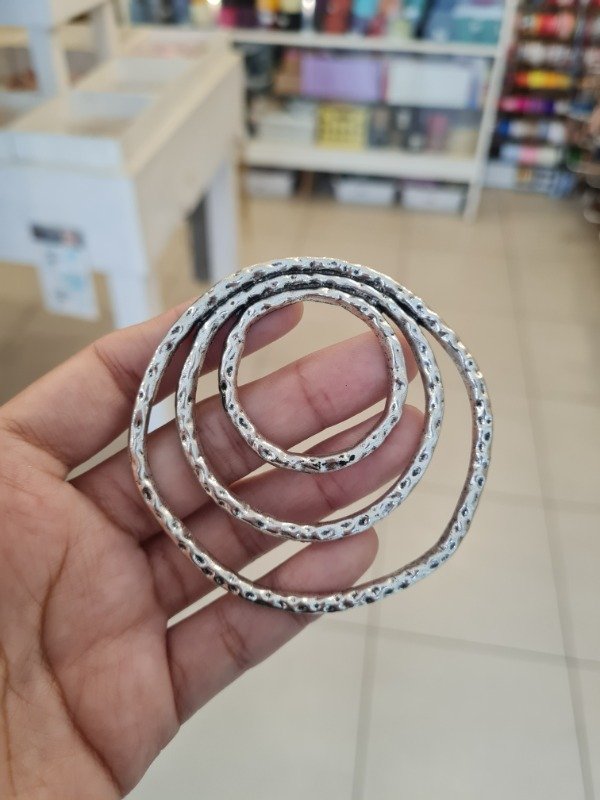 Producto - DIJE TRIPLE CÍRCULO