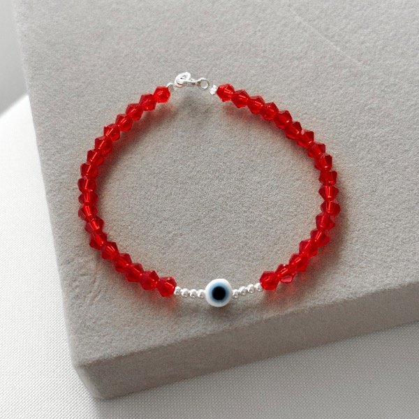 Producto - Pulsera cristal de roca con ojito (bolitas y cierre de plata)