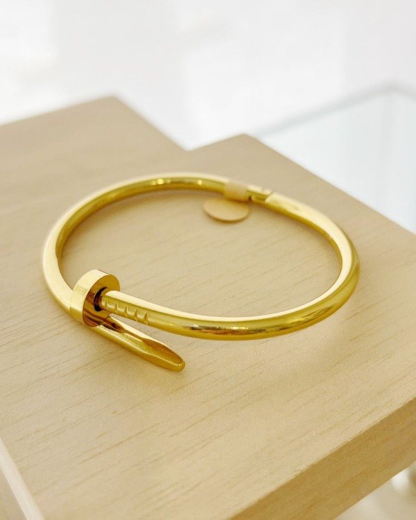 Producto - Pulsera Clav Acero dorado.