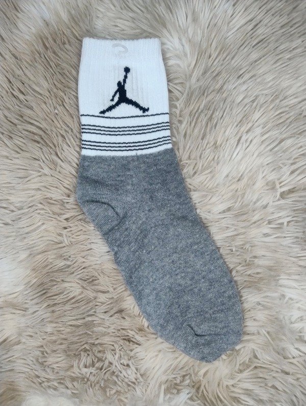 Producto - Tenis adulto hombre saltando gris
