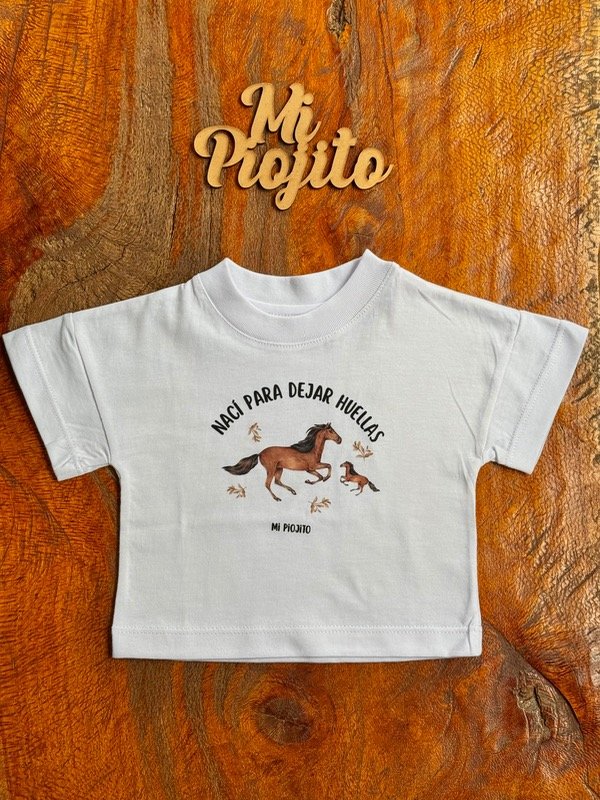 Producto - Remera Oversize Nací para dejar huellas