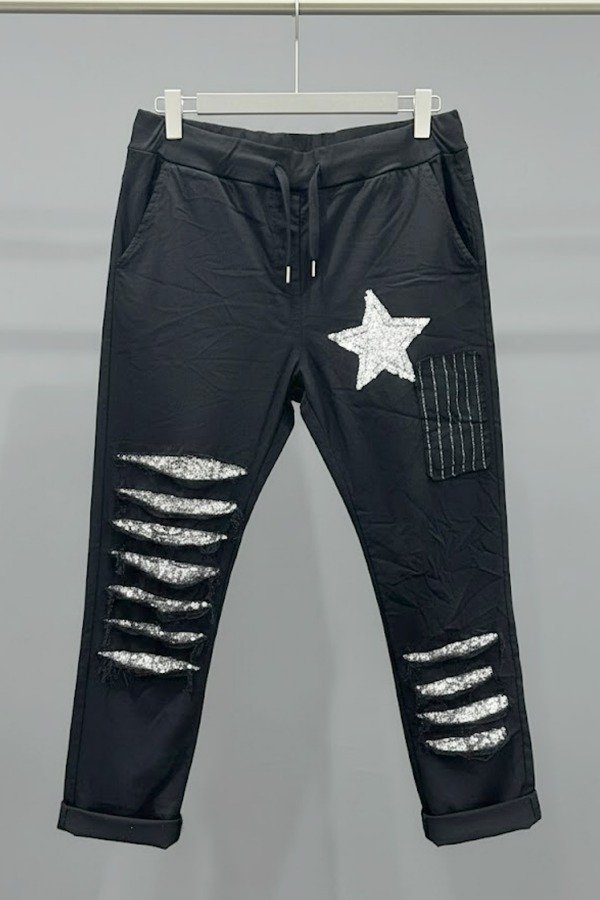 Producto - BABUCHA NEGRA ESTRELLA. Cede hasta 130