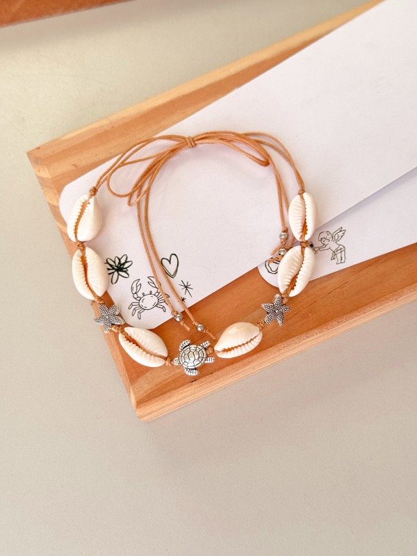 Producto - Tobillera caracoles con dijes metal