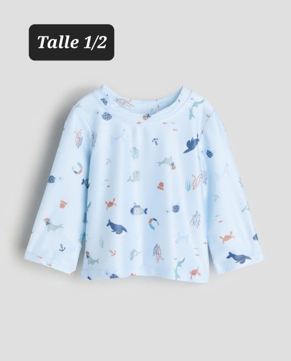 Remera uv HyM talle 1/2 celeste